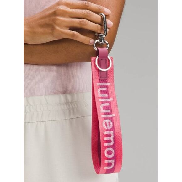 Lululemon Handbags - NWT Lululemon Never Lost Keychain Sakura Pink/Washed Mauve/White